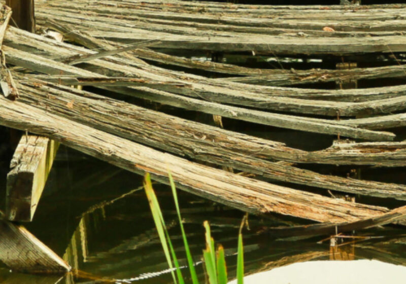 Damaged bridge over water